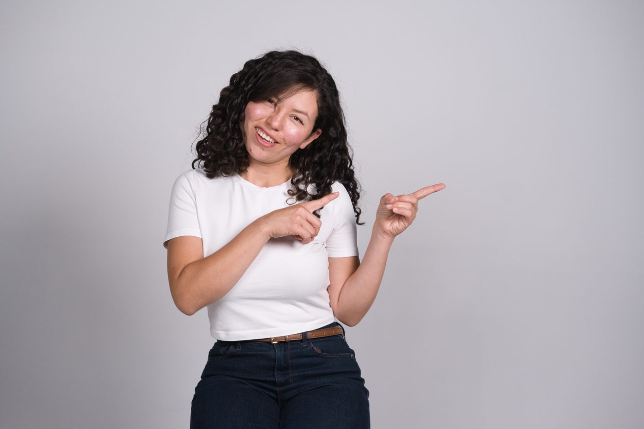 Lucy pointing to the topics she teaches